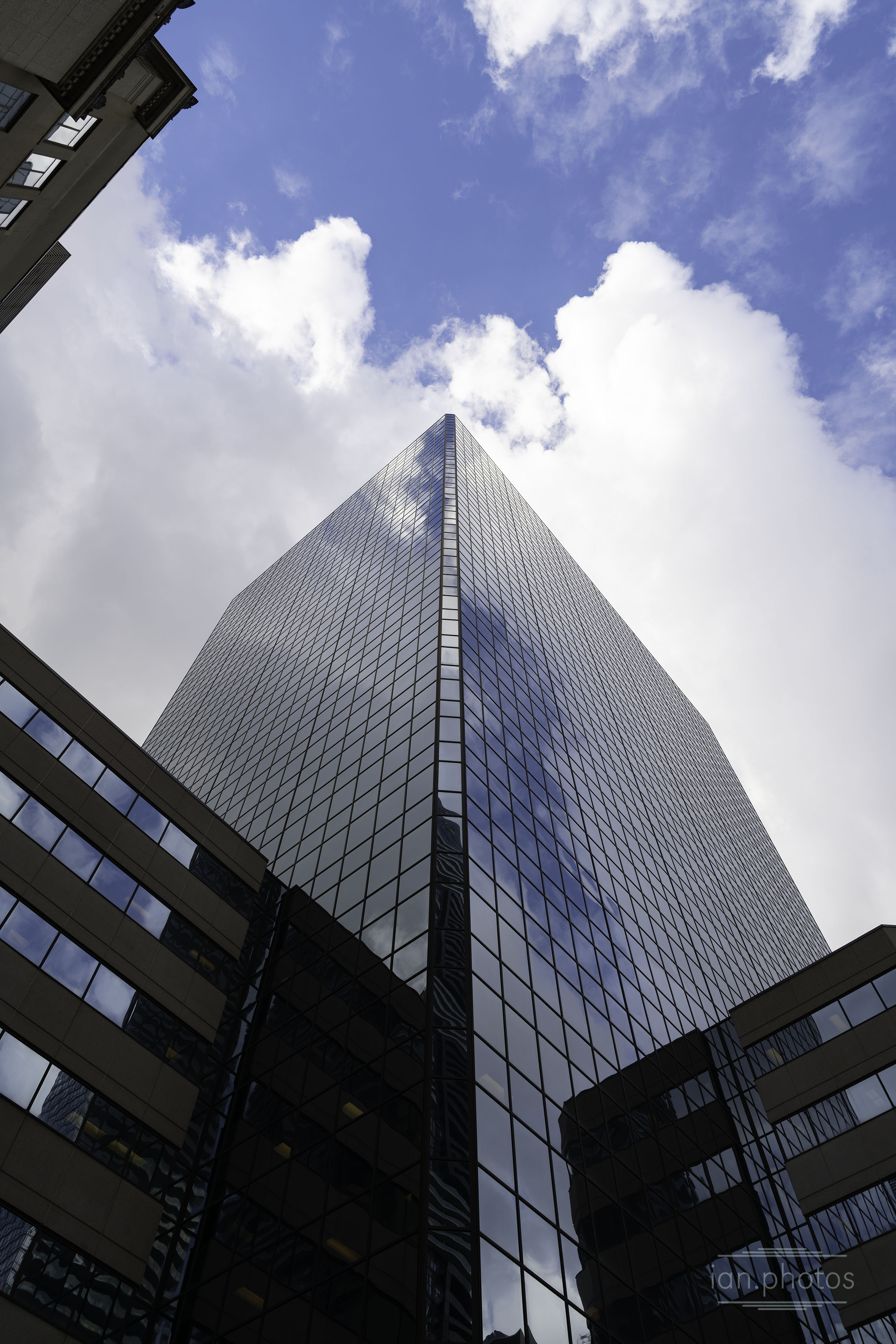 Towering Skyscrapper on a cloudy day. | ian.photos