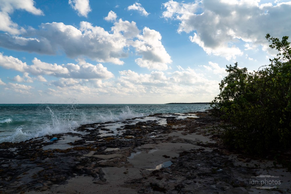 Sunny day with clouds on a rocky beach | ian.photos